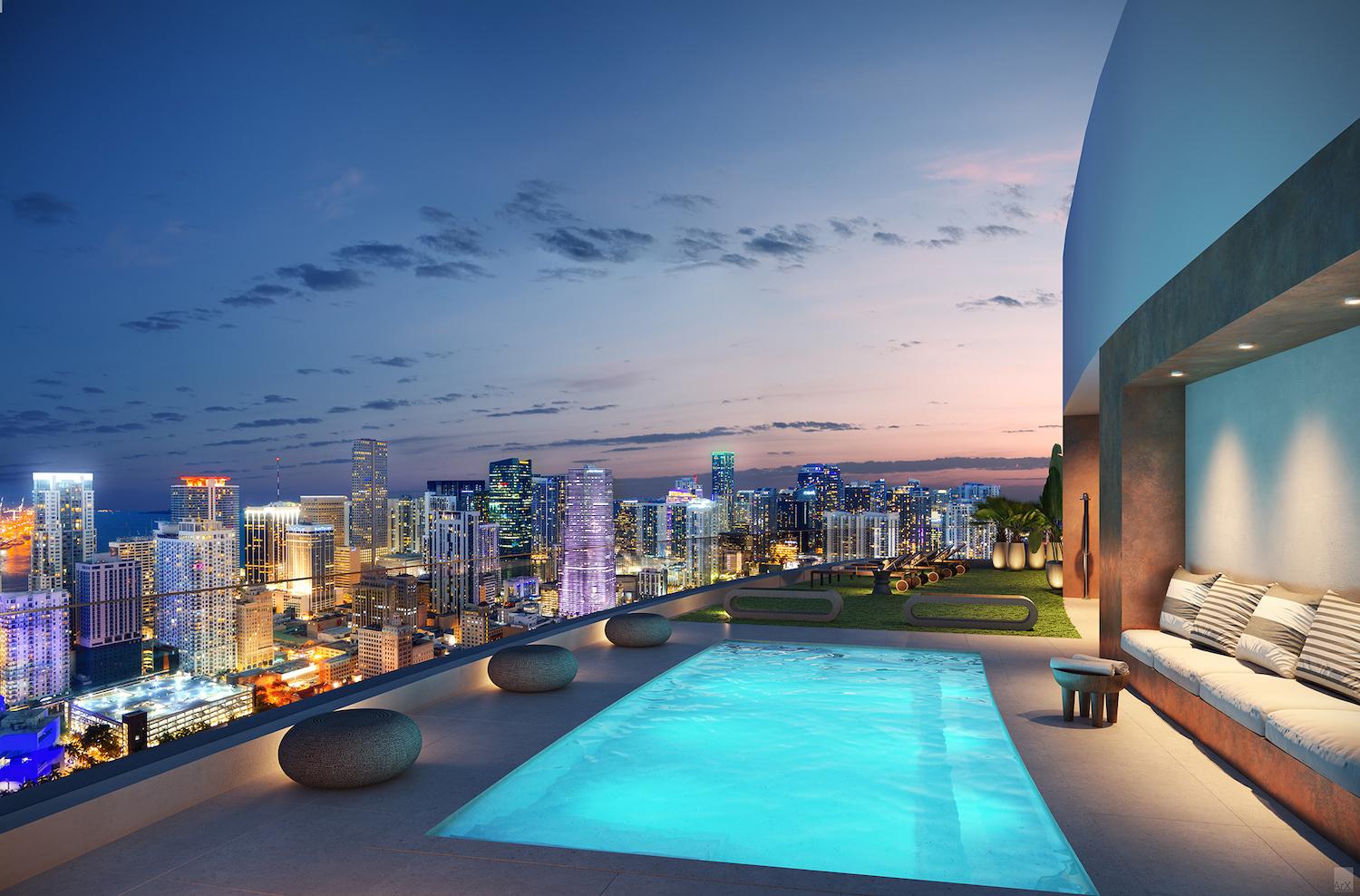 Rooftop pool and amenity deck — panoramic night view of the Miami skyline